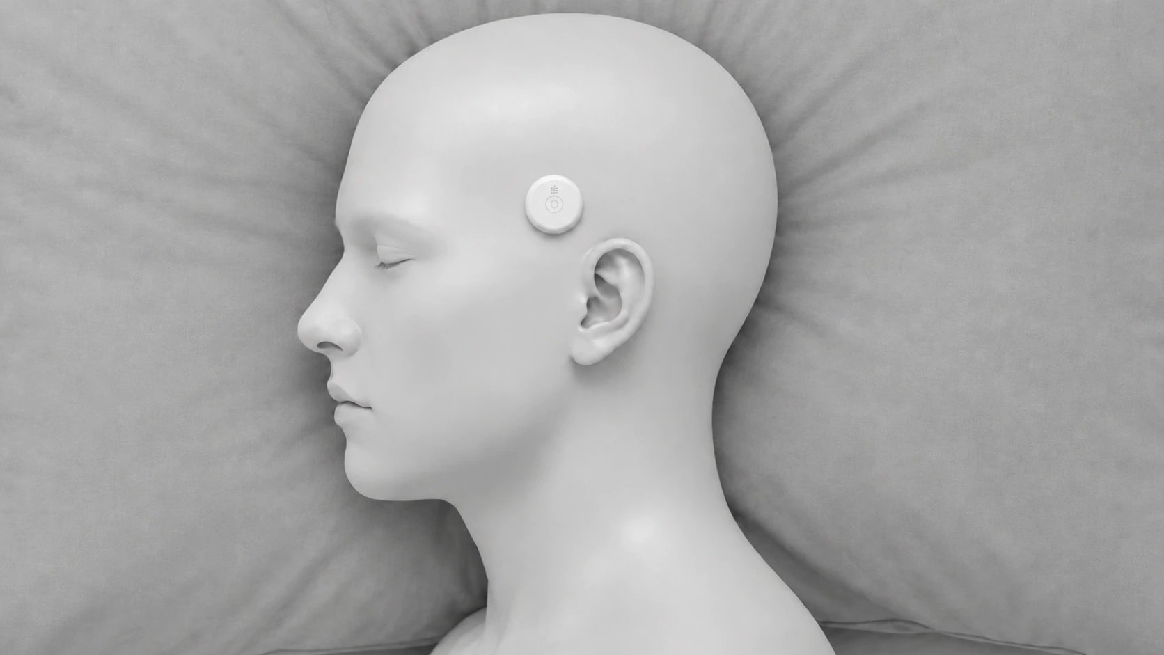 A head resting on a pillow, wearing the temple patch.